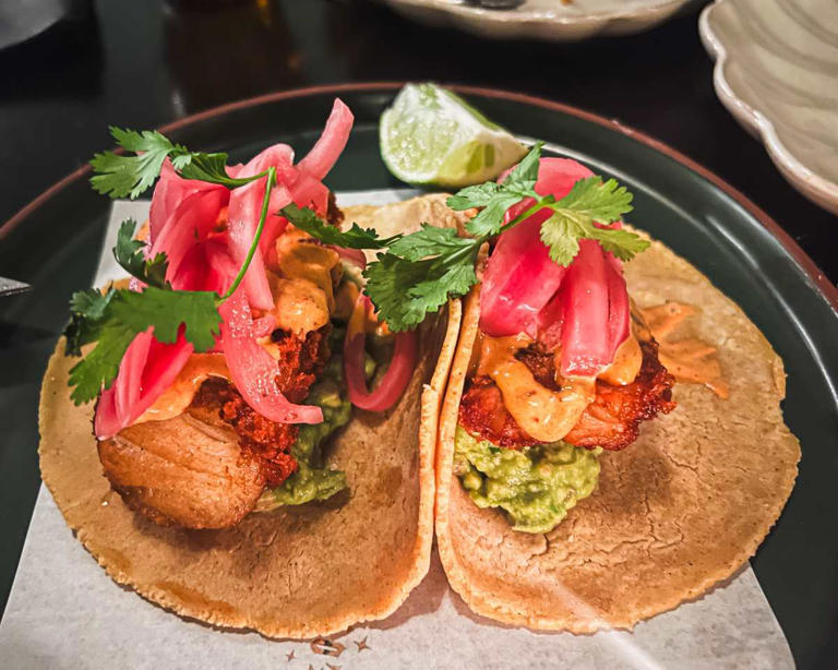 Frijoleros signature dishes GuacamoleTacos de PescadoChilaquiles